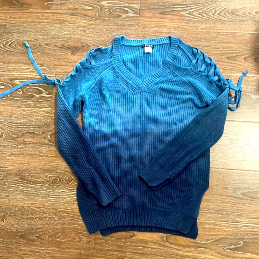 Blue sweater with ties along sleeves.  So cute with leggings or jeans